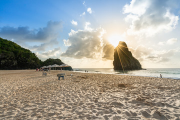 Beautiful Sunset at Cacimba do Padre beach with the view of Dois Irmaos Hill and turquoise clear...