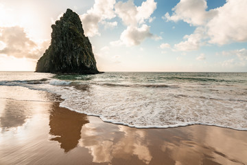 Beautiful Sunset at Cacimba do Padre beach with the view of Dois Irmaos Hill and turquoise clear water, at Fernando de Noronha, Unesco World Heritage site, Pernambuco, Brazil