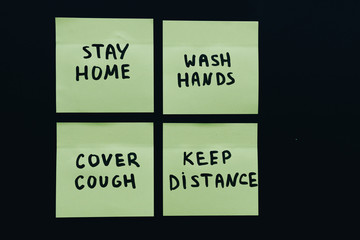 Four official who preventive measures on sticky post it notes isolated on deep black background:...