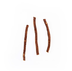 Close up of Ayurvedic herb Liquorice root,Licorice root, Mulethi or Glycyrrhiza glabra root on a wooden surface is very much beneficial for Soothes your stomach,poisoning, stomach ulcers
