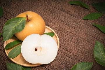 Snow pear or Korean pear on a wooden background, Nashi pear fruits delicious and sweet on wooden background