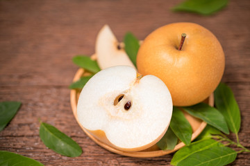 Snow pear or Korean pear on a wooden background, Nashi pear fruits delicious and sweet on wooden background