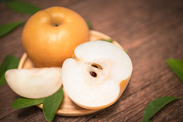 Snow pear or Korean pear on a wooden background, Nashi pear fruits delicious and sweet on wooden background