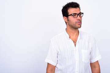 Fototapeta premium Portrait of handsome Turkish man with eyeglasses thinking