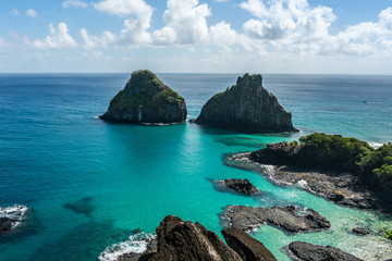 Aerial view of Dois Irmaos Hill at Baia dos Porcos beach, with turquoise clear water, at Fernando de Noronha Marine National Park, a Unesco World Heritage site, Pernambuco, Brazil