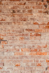 Old and damaged interior shot of a brick wall