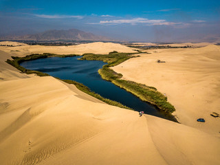 Aerial view of oasis in the desert in Peru, Moron Lake.