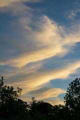 Fototapeta na wymiar Sunset Against the Clouds