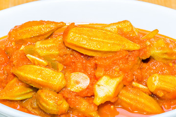 Stewed Okra Casserole with tomato sauce close up 