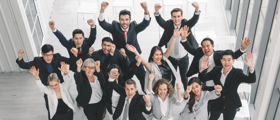 business background of diverse businesspeople standing together in a group and having arms cross...