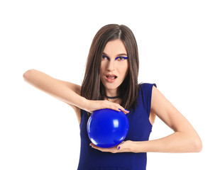 Portrait of fashionable young woman with air balloon on white background