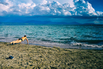Pushups sport sea beach on blue background. Travel tourism beach paradise palm.