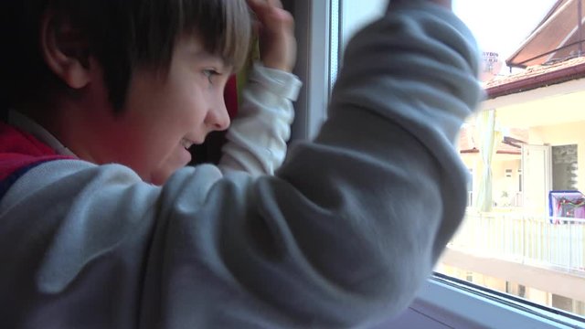 4K Coronavirus isolation - Locked down child beats against the window
