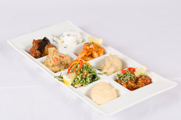 A variety of Appetizer inside scoop with Oil	