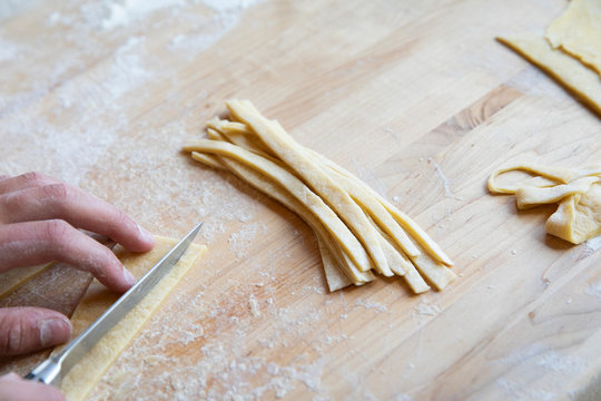 Teenager making homemade pasta
