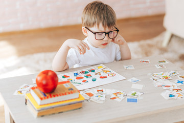 The child is studying at home, English learning with cards, educational games for children,...
