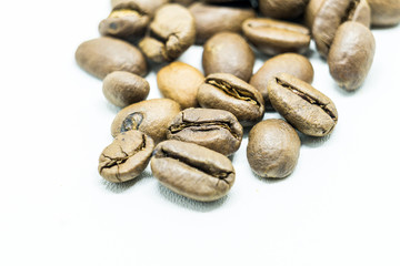 Close up of coffee beans isolated on white background