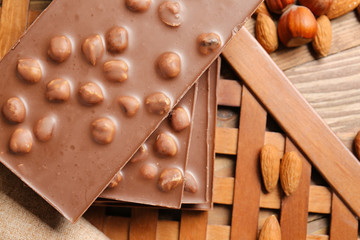 Sweet chocolate with nuts on table