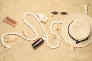 Fototapeta na wymiar Summer composition with beach accessories on sand