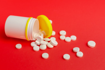 Bottle with pills on color background
