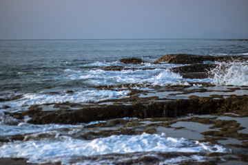 A shot of the Indian Ocean waves crashing on Rocky beach of Neil Island