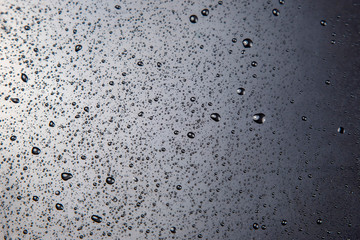 small drops of water on a plastic surface. texture and abstract background