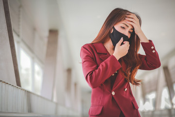 Fototapeta premium Asian woman wearing mask for protect pm2.5 and cough with Covid-19 virus outbreak in public. But her with severe coughing and chest pain.