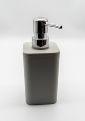 Fototapeta na wymiar Hand pump sanitizer grey bottle isolated on white