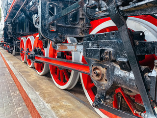 brake system iron wheels of stream engine locomotive train on railways track forward use for old and classic period land transport and retro vintage style background