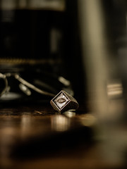 Silver Ring on Wood Table