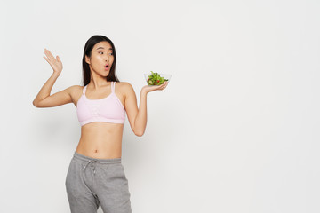 young woman holding a healthy salad