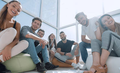 group of initiative young people sitting in a creative office