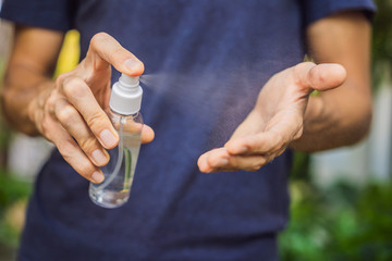Men's hands using wash hand sanitizer gel