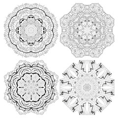 Hand drawn zentangle set of 4 mandalas for coloring page.