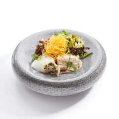 Salad with squid and fried potatoes