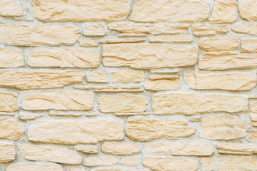 Marble brick stone tile wall texture background in light beige yellow cream color