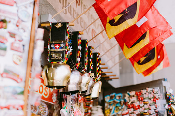 swiss souvenirs bells and magnets with post cards from switzerland