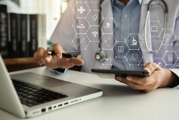 Doctor hand working with modern digital tablet computer interface as medical network concept in the...