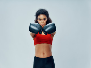 young woman with boxing gloves