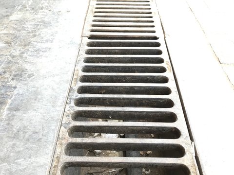 Channel gratings made of ductile iron material for drainage purpose at an car cleaning location so that dirty water runs towards through this gratings to manhole