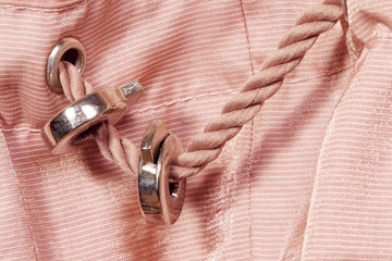 Naklejka premium Pink lace. Pink Synthetic fabric texture, background. Black fabric,textile accessories