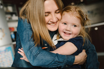 Mother with a kid at home. Quarantine and closed nursery school during coronavirus outbreak. Mom...