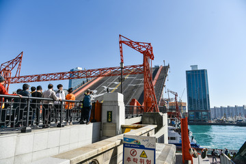Busan city, South Korea - OCT 31, 2019: Tourists near drawbridge- Yeongdodaegyo Bridge in Jung-gu, Busan
