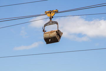 Cable car on mining site with ore carts wagons