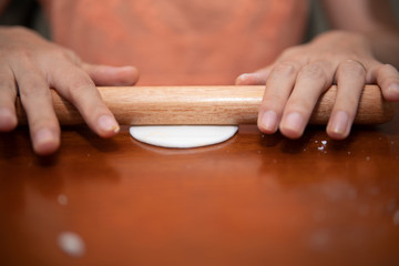 young women preparing vegetable clear shrimp and pork dumplings in quarantine for coronavirus wearing protective mask during covid-19 pandemic 