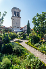 Naklejka premium SIBENIK / CROATIA - AUGUST 2015: Small garden in the historic centre of Sibenik, Croatia