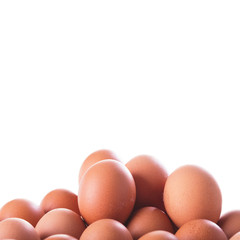 Pile of Fresh eggs, closeup on white background