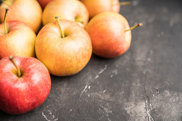 Close-up apples on the rustic wooden background. Selective focus. Shallow depth of field.