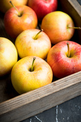 Close-up apples on the rustic wooden background. Selective focus. Shallow depth of field.