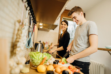 Happy couple enjoying cooking time together at home.Enjoying simple moments.Making vegan...